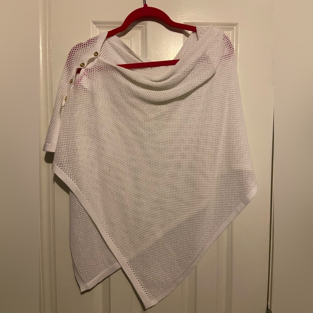 White Shaw that has maybe been worn once over a dress.